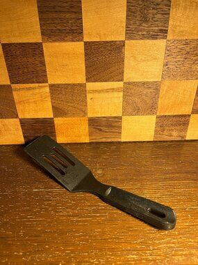 Mini Black Nylon Pampered Chef Spatula, end is worn